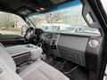 Interior view of a 2013 Ford F-350 Super Duty featuring gray seating dashboard and various controls