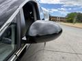 A 2014 Honda Odyssey with a black side mirror positioned next to an open window