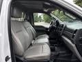Interior view of a 2018 Ford F-550 showing two front leather seats and the dashboard with controls
