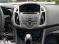 Dashboard of a 2016 Ford Transit Connect featuring a central control panel with buttons for radio media and climate control