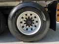 Close-up of a 2005 Volvo VND 122 tire featuring a silver rim and black rubber tread with the label H778215 on the sidewall