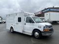 A 2016 Chevrolet Express van designed for emergency services with a white exterior and side door for access