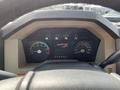 Dashboard of a 2014 Ford F-350 SD showing speedometer and other gauges with a gear selector indicating Park Reverse Neutral Drive Manual 21