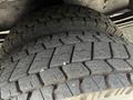 Close-up of a tire with deep tread patterns from a 2008 Morgan Olson Workhorse vehicle
