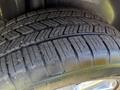 Close-up of a tire with a tread pattern showing significant depth on a 2013 Lincoln MKT