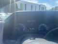 Dashboard of a 2009 Ford Econoline displaying speedometer fuel gauge odometer and gear indicator