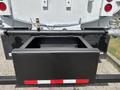 A 2016 Ford F-750 truck with a rear-mounted hitch and storage compartment in a black finish