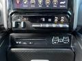 Dashboard controls of a 2019 RAM 1500 featuring climate controls tow/haul settings and auxiliary ports