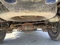 Undercarriage view of a 2011 RAM 1500 showcasing the rear axle and suspension components