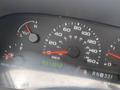Dashboard of a 2003 Ford F-450 SD displaying gauges for oil pressure speed and fuel level along with a digital odometer reading 973942