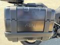 A black Givi motorcycle storage case mounted on a 2021 Harley-Davidson RA1250 S