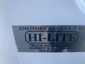 A label on a white truck indicating it is a product of Hi-Lite Truck Accessories from Surrey B.C Canada with a contact number 604-534-3838