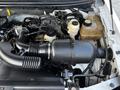 A close-up of the engine compartment of a 2008 Ford F-150 XL showing the air intake system and various engine components