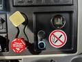 The dashboard of a 2008 International 7500 featuring a trailer air supply control a gauge and a no smoking sign