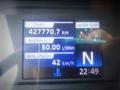 Dashboard display of a 2013 Hino 308 showing trip distance, average fuel consumption, average speed, and water temperature gauge