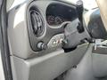 Interior view of a 2008 Ford Econoline dashboard showing the steering wheel dials and control buttons