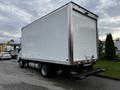 A 2018 Hino 195 truck with a large white cargo box and a step bumper at the rear