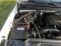 Engine compartment of a 2017 Chevrolet Silverado 3500HD showcasing components like the battery air intake and various hoses and electrical connections