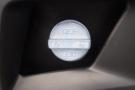 A close-up of the DEF cap on a 2015 Kenworth T660 with a blue plastic design and marked with the letters DEF