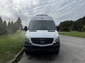 A 2016 Mercedes-Benz Sprinter van positioned facing forward with a white exterior and distinctive front grille featuring the Mercedes logo