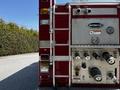 2006 Emergency One Fire Truck featuring a chrome exterior a ladder on the side and various control valves and gauges on the rear panel