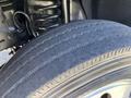 Close-up of a tire belonging to a 2016 Ford F-550 showing tread patterns and sidewall details