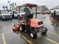 A red and orange 2010 Kubota F3680 lawn mower with a large cutting deck and a driver's seat is parked on a paved surface