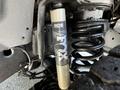 Close-up of a BDS suspension shock absorber and coil spring on a 2022 RAM 3500 showcasing its heavy-duty off-road components