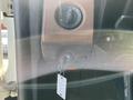 The image shows the ignition key slot and control knobs of a 2022 Freightliner Cascadia truck's dashboard