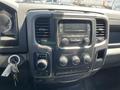 Interior dashboard of a 2019 RAM 1500 Classic featuring a radio display climate control knobs and gear shift selector