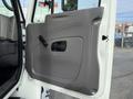 2008 International 4300 truck door panel featuring a smooth gray surface and a black door handle
