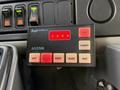 A black control panel with various buttons including left center right flash and fast indicators along with red lights displaying on the panel