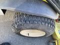 A close-up view of a tire from a 2010 Kubota F3680 featuring a tread pattern designed for traction and stability on various surfaces