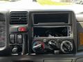 The dashboard of a 2009 Ford LCF 550 featuring climate controls and a missing stereo insert with various buttons and indicators