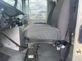 The interior of a 2007 Morgan Olson Workhorse W42 featuring two gray upholstered seats with seatbelt attachments and a view of the dashboard controls