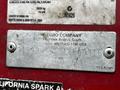 Metal identification plate of a 2012 Toro Groundsmaster showing company name model number and specifications