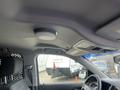 The image shows the interior ceiling of a 2016 Chevrolet Tahoe with a circular light fixture and overhead console systems