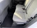 The image shows the backseat of a 2020 Ford Escape featuring two gray upholstered seats with a textured pattern and seatbelts