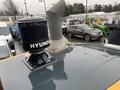 A 2016 Hyundai HL940 construction vehicle with a prominent ventilator and manufacturer branding on the top of the cab