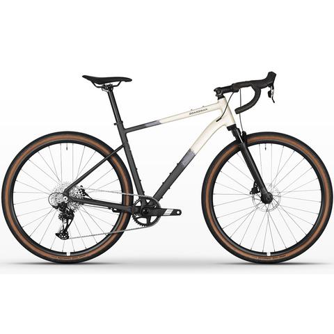 2026 Boardman TRVL 8.9 DB Alloy All Road Bike featuring a sleek frame with black and white colors and brown rimmed tires designed for versatility and performance