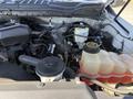 Engine compartment of a 2017 Ford F-350 SD showcasing various components including the coolant reservoir and engine parts