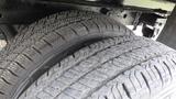 Close-up view of two tires of a 2018 Ford Transit showing detailed tread patterns and textures