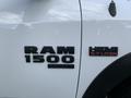 A 2021 RAM 1500 truck displaying the RAM emblem and HEMI 5.7 LITER badge on the side door