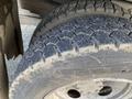 Close-up of a heavily worn tire from a 2009 Dodge Ram 5500 showing signs of cracking and reduced tread depth and wear patterns