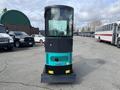 2024 AGT Industrial Green QH13R Mini Excavator with a transparent cab and blue accents standing on a paved surface