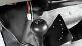 A black gear shift lever for a 2007 Ford F-550 with markings for 2H 4H N and 4L