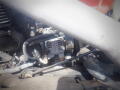 Close-up view of the engine compartment showcasing the alternator of a 2016 International WorkStar 7500 with visible wiring and engine components