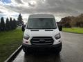 White 2020 Ford Transit van facing forward with distinctive front grille and headlights