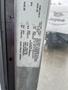 2012 Ford Econoline with a visible door sticker displaying specifications and tire information
