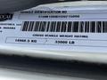 A vehicle identification sticker displaying the gross vehicle weight rating of a 2012 Autocar Xpert with a weight of 14968.5 kg and 33000 lb